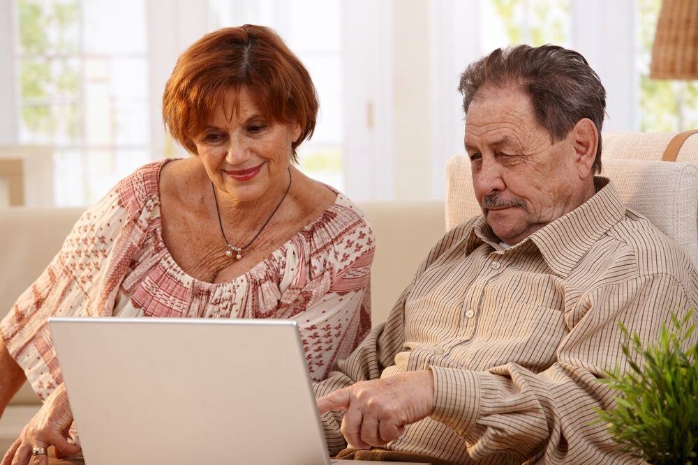 Mature Couple using laptop-3